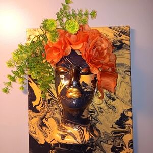 Elegant Gold and Black Sculpture with Orange Floral Design